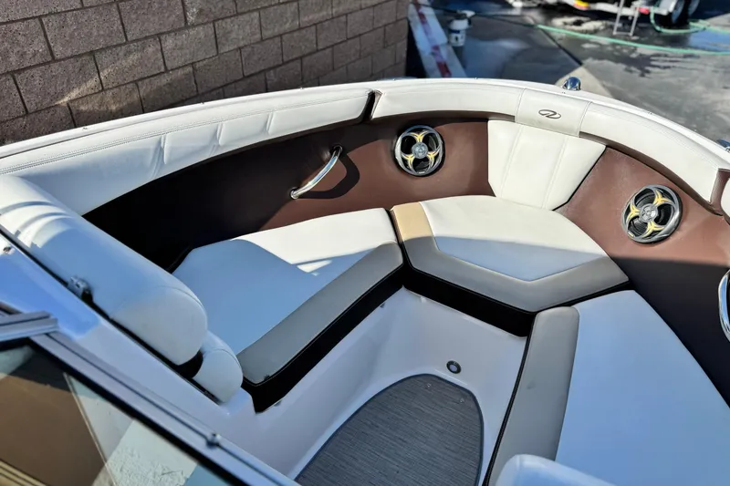 Slide: The Image of Interior of a 2016 Regal 2000 ES boat with white and brown seating. - 11