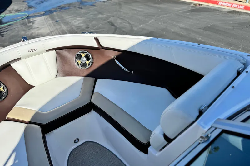 Slide: The Image of Interior of 2016 Regal 2000 ES boat with white and brown seating. - 12