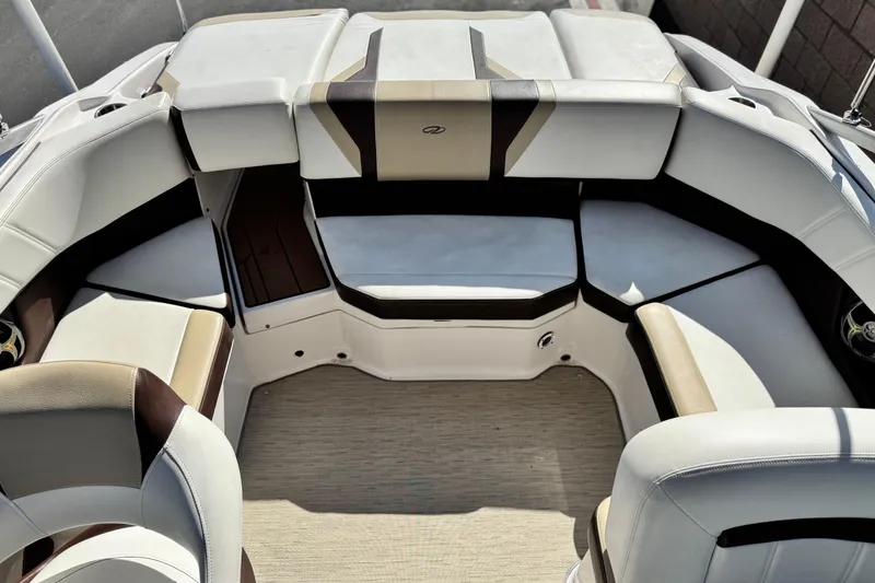 Slide: The Image of Interior of a 2016 Regal 2000 ES boat with white and brown seating. - 14