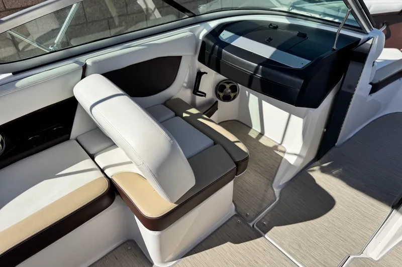 Slide: The Image of Interior of a 2016 Regal 2000 ES boat with beige and brown seating. - 19