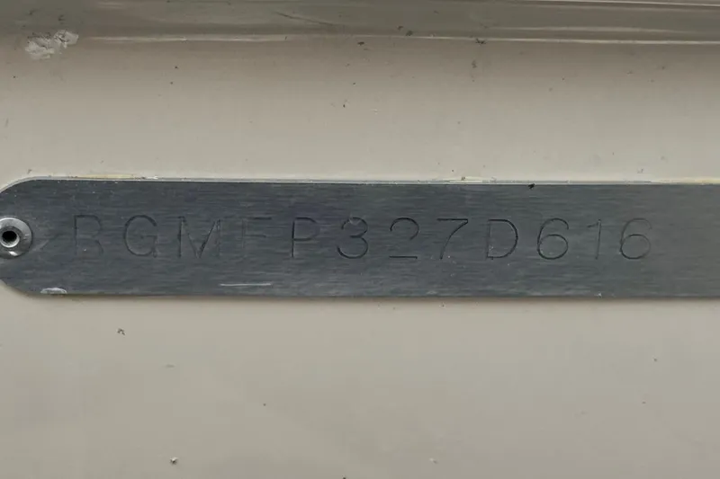 Slide: The Image of Metal plate with engraved code "RGMFP327D616" on a Regal 2000 ES, 2016 model. - 28