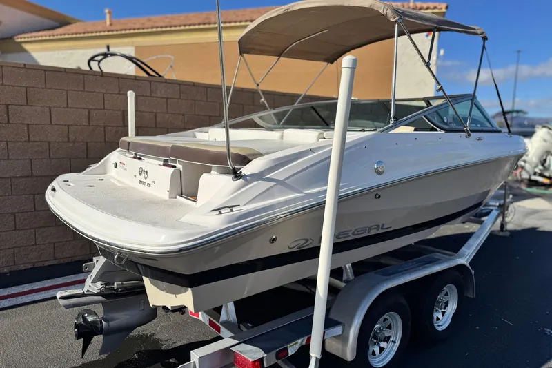Slide: The Image of 2016 Regal 2000 ES boat on trailer, parked outdoors with canopy. - 5