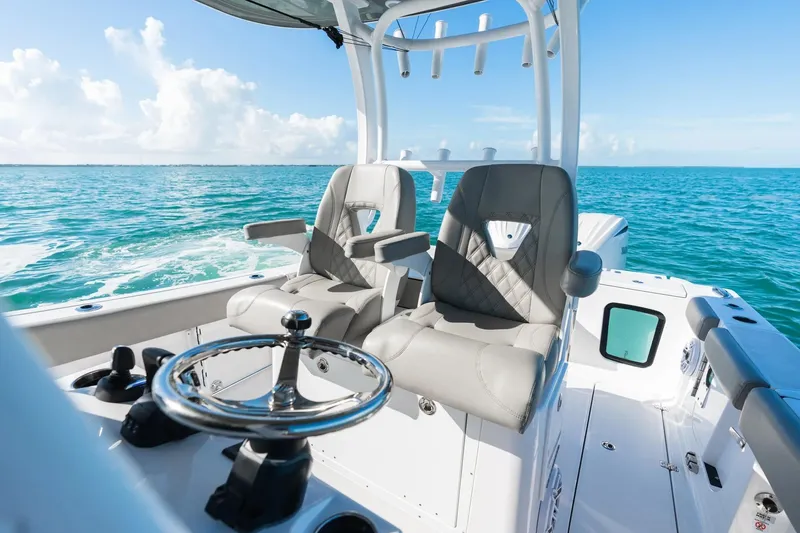 Slide: The Image of 2026 Sportsman Open 282 Center Console boat interior on open water. - 13
