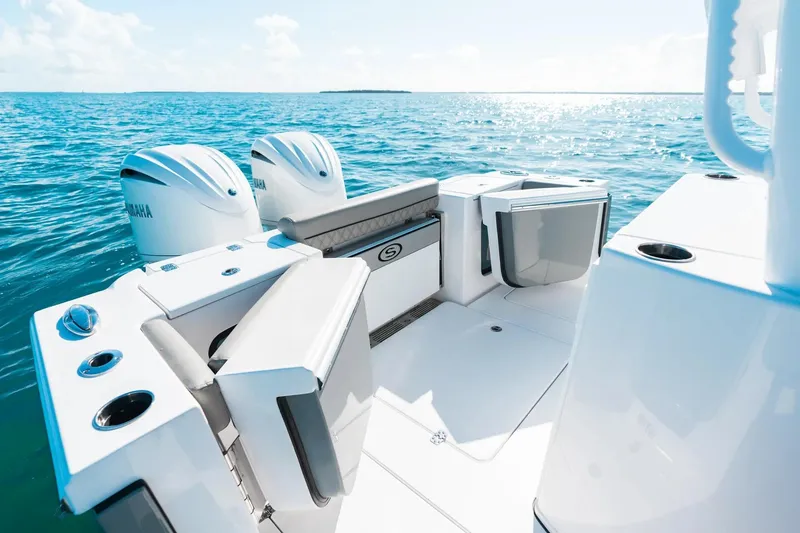 Slide: The Image of 2026 Sportsman Open 282 Center Console boat on open water, featuring dual Yamaha engines. - 18