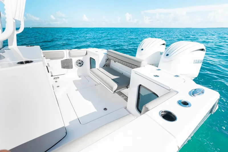 Slide: The Image of 2026 Sportsman Open 282 Center Console boat on clear blue ocean water. - 19