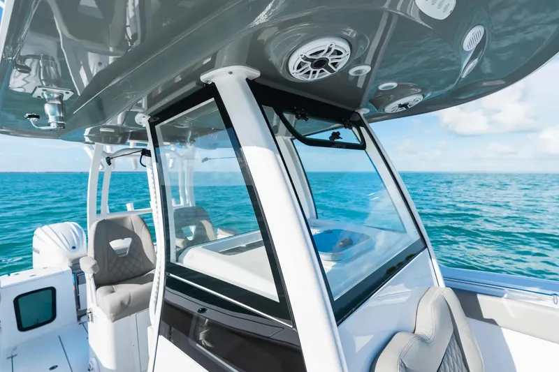 Slide: The Image of 2026 Sportsman Open 282 Center Console boat on open sea, featuring sleek design and modern amenities. - 7