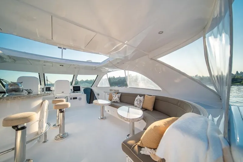 Slide: The Image of Luxurious interior of 2008 Hatteras 72 Motor Yacht with elegant seating and panoramic views. - 10