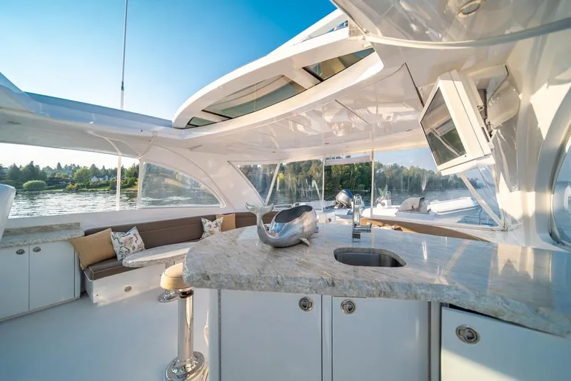 Slide: The Image of Luxurious 2008 Hatteras 72 Motor Yacht interior with elegant seating and modern amenities. - 13