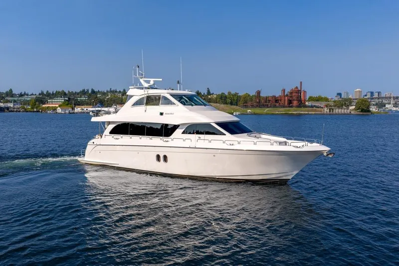 Slide: The Image of 2008 Hatteras 72 Motor Yacht cruising on a scenic waterway. - 2