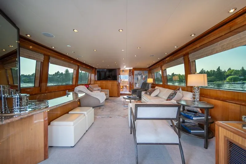 Slide: The Image of Luxurious interior of 2008 Hatteras 72 Motor Yacht with elegant seating and large windows. - 21