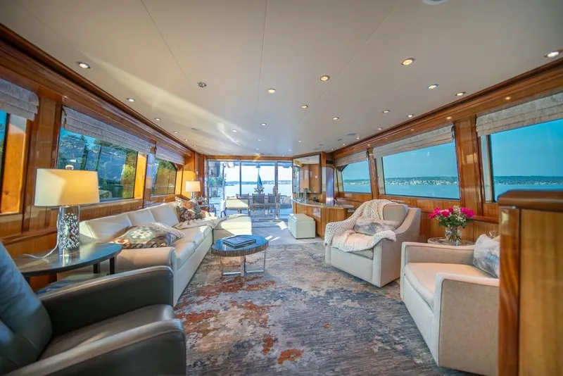 Slide: The Image of Luxurious interior of 2008 Hatteras 72 Motor Yacht with elegant seating and panoramic windows. - 22