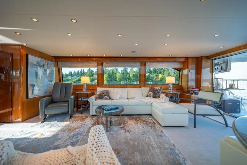 Slide: The Image of Luxurious interior of 2008 Hatteras 72 Motor Yacht with elegant seating and large windows. - 25