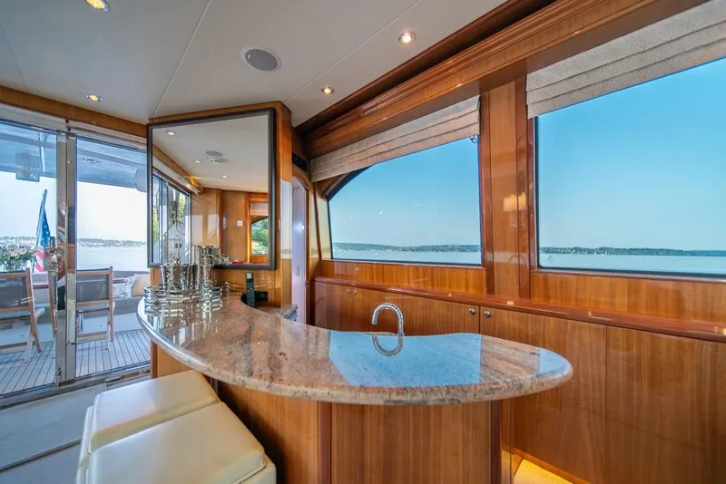 Slide: The Image of Luxurious interior of 2008 Hatteras 72 Motor Yacht with elegant bar and scenic views. - 27