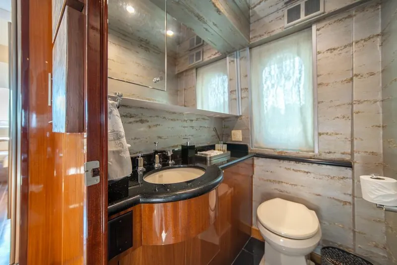 Slide: The Image of Luxurious bathroom in 2008 Hatteras 72 Motor Yacht with elegant fixtures and wood accents. - 29