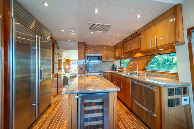 Slide: The Image of Luxurious kitchen interior of 2008 Hatteras 72 Motor Yacht with modern appliances and wood finishes. - 30