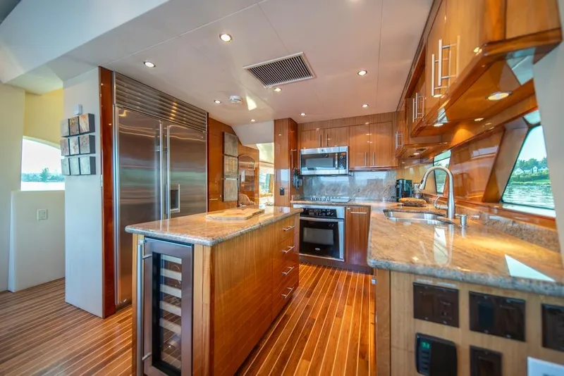 Slide: The Image of Luxurious kitchen interior of 2008 Hatteras 72 Motor Yacht with modern appliances and wood finishes. - 32