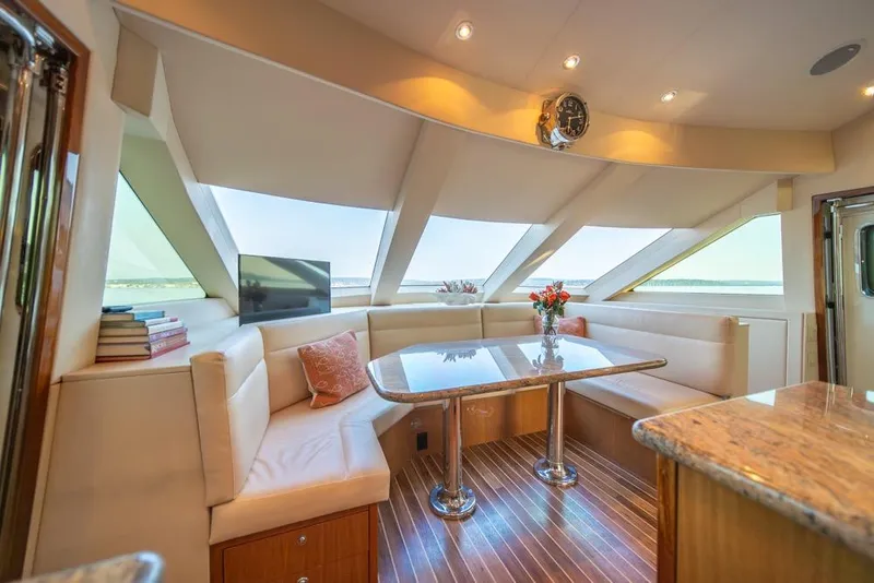 Slide: The Image of Luxurious interior of 2008 Hatteras 72 Motor Yacht with elegant seating and panoramic windows. - 34
