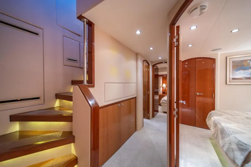 Slide: The Image of Interior of 2008 Hatteras 72 Motor Yacht with elegant wood finishes and cozy lighting. - 35