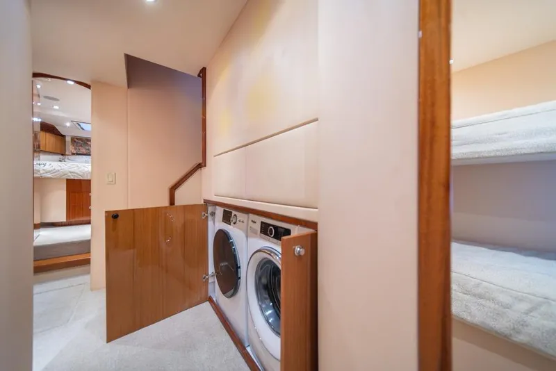 Slide: The Image of Laundry area inside 2008 Hatteras 72 Motor Yacht with washer and dryer. - 36