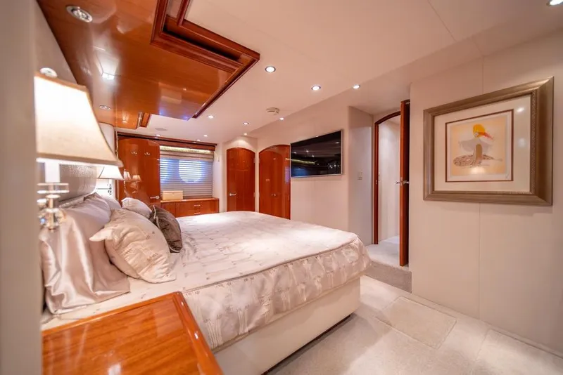 Slide: The Image of Luxurious bedroom interior of 2008 Hatteras 72 Motor Yacht with elegant wood finishes. - 38