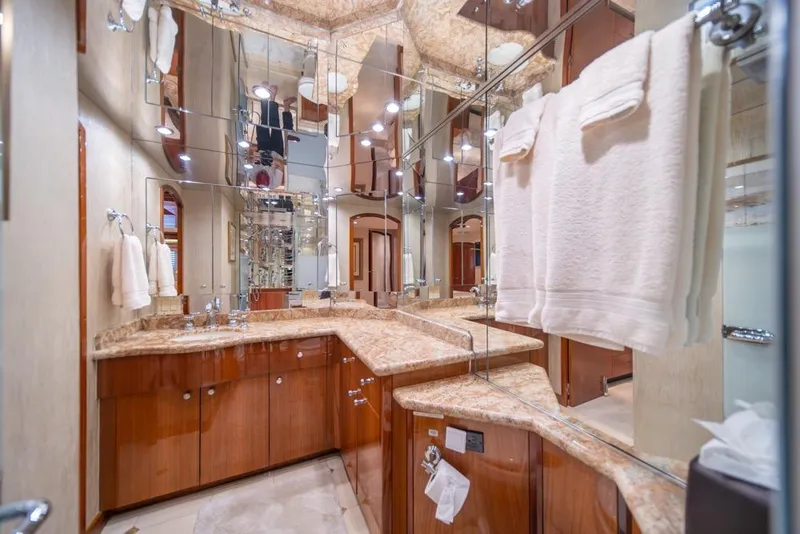Slide: The Image of Luxurious bathroom in 2008 Hatteras 72 Motor Yacht with marble countertops and mirrored walls. - 39