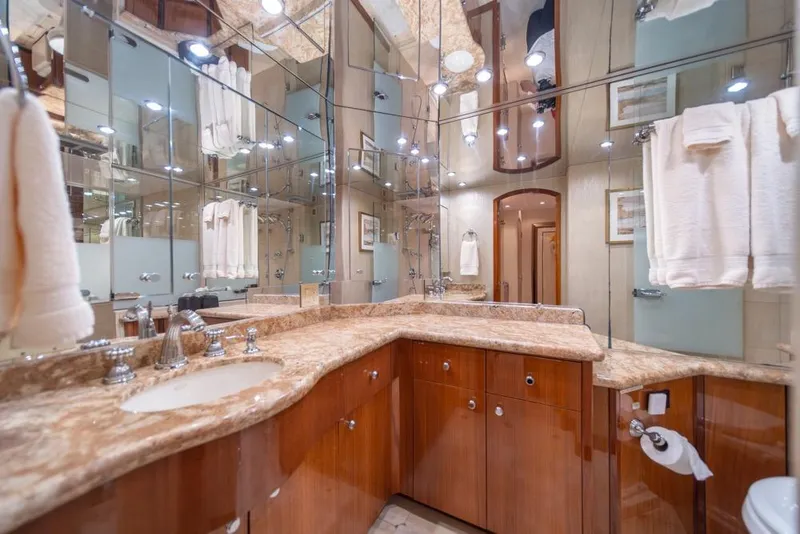 Slide: The Image of Luxurious bathroom in 2008 Hatteras 72 Motor Yacht with marble countertops and mirrored walls. - 40