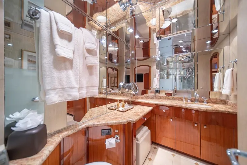 Slide: The Image of Luxurious bathroom in 2008 Hatteras 72 Motor Yacht with elegant wood cabinetry and marble countertops. - 41
