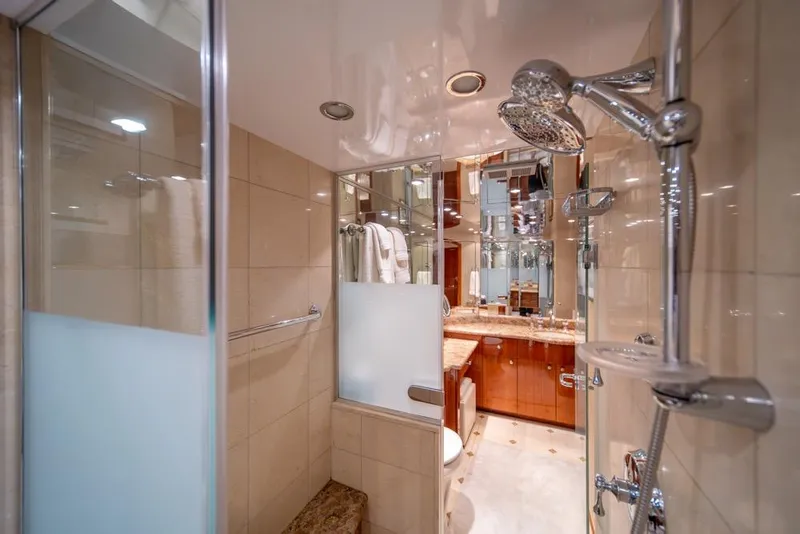 Slide: The Image of Luxurious bathroom in 2008 Hatteras 72 Motor Yacht with modern fixtures and elegant design. - 42