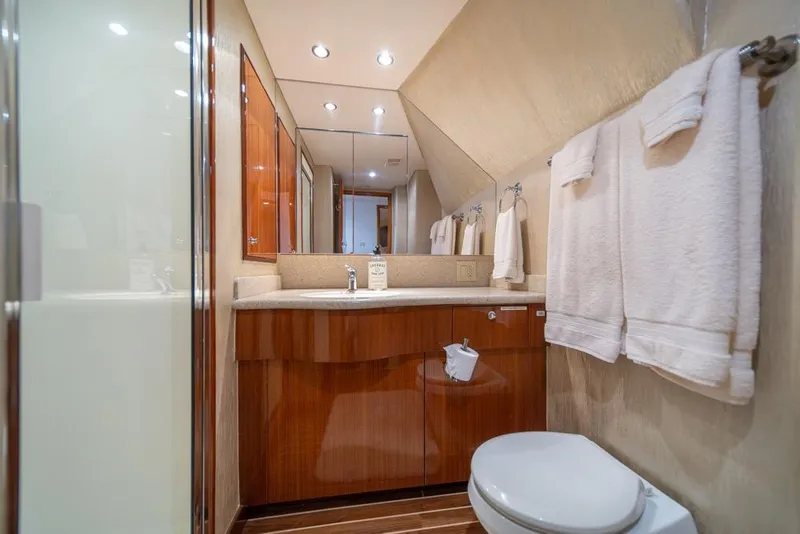 Slide: The Image of Luxurious bathroom in 2008 Hatteras 72 Motor Yacht with elegant wood cabinetry and modern fixtures. - 45