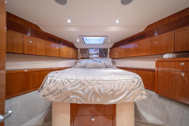 Slide: The Image of Luxurious bedroom interior of 2008 Hatteras 72 Motor Yacht with elegant wood cabinetry. - 46