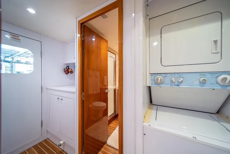 Slide: The Image of Laundry area in 2008 Hatteras 72 Motor Yacht with washer and dryer. - 51