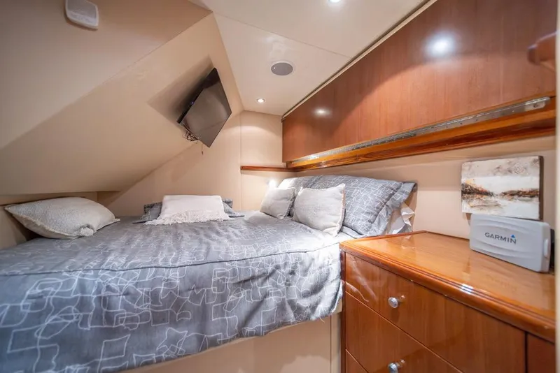 Slide: The Image of Luxurious cabin interior of 2008 Hatteras 72 Motor Yacht with cozy bedding and wooden cabinetry. - 52