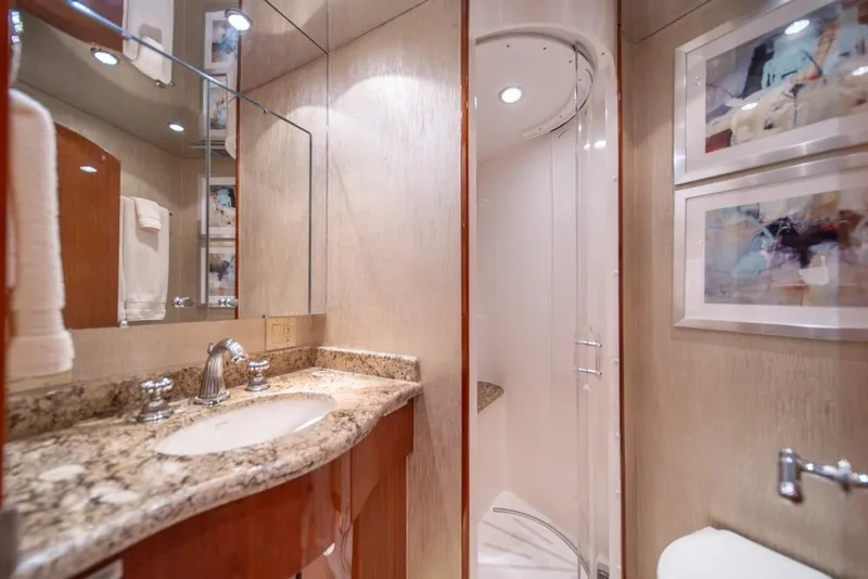 Slide: The Image of Luxurious bathroom in 2008 Hatteras 72 Motor Yacht with granite countertop and shower. - 53