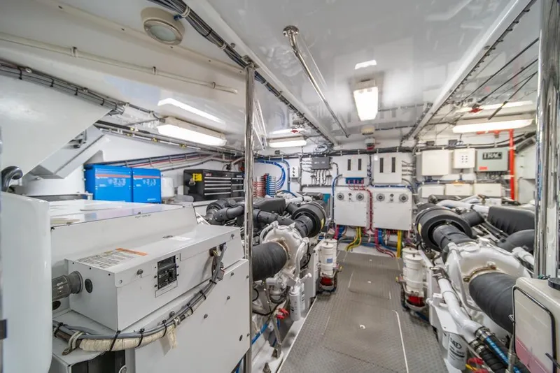 Slide: The Image of Engine room of 2008 Hatteras 72 Motor Yacht, showcasing machinery and equipment. - 54