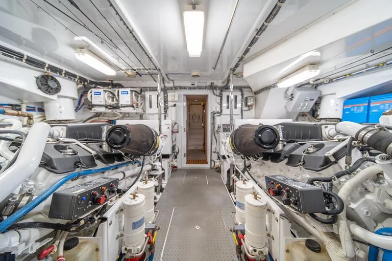 Slide: The Image of Engine room of a 2008 Hatteras 72 Motor Yacht, showcasing dual engines and equipment. - 55