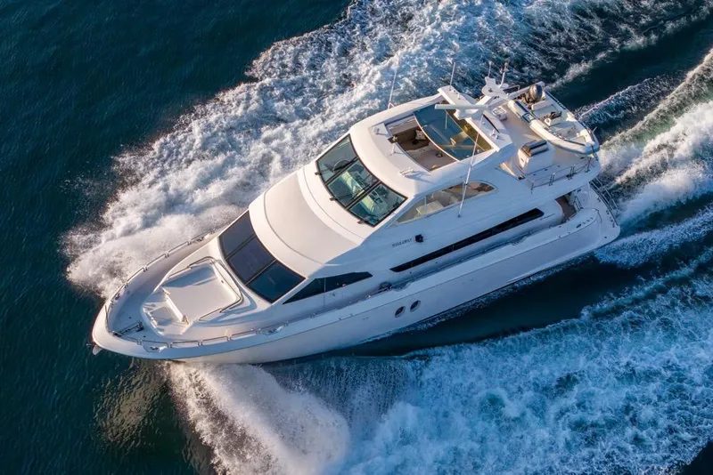 Slide: The Image of 2008 Hatteras 72 Motor Yacht cruising on open water, aerial view. - 6