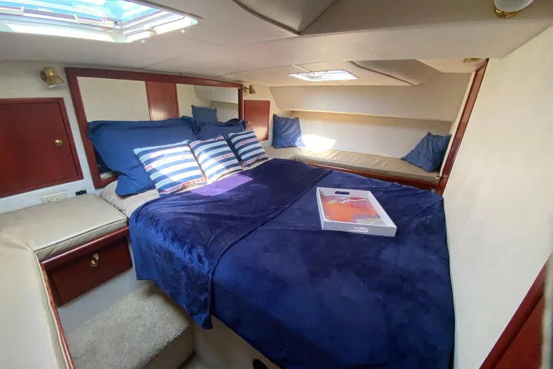 Slide: The Image of Luxurious cabin interior of 2003 Zeta 36 yacht with cozy bedding and skylight. - 20