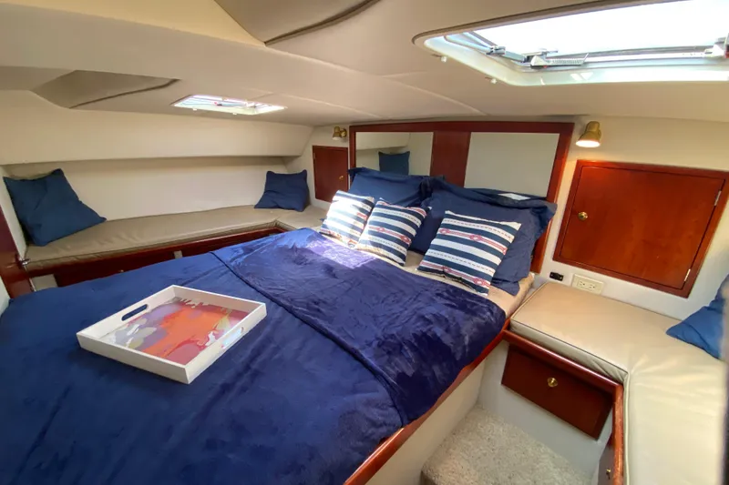 Slide: The Image of Cozy cabin interior of 2003 Zeta 36 yacht with plush bedding and nautical decor. - 21