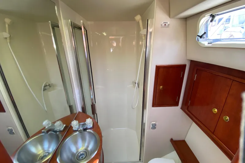 Slide: The Image of Luxurious bathroom in 2003 Zeta 36 yacht with shower and dual sinks. - 25