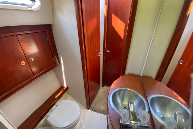 Slide: The Image of Luxurious bathroom in 2003 Zeta 36 yacht with wooden cabinets and modern fixtures. - 26