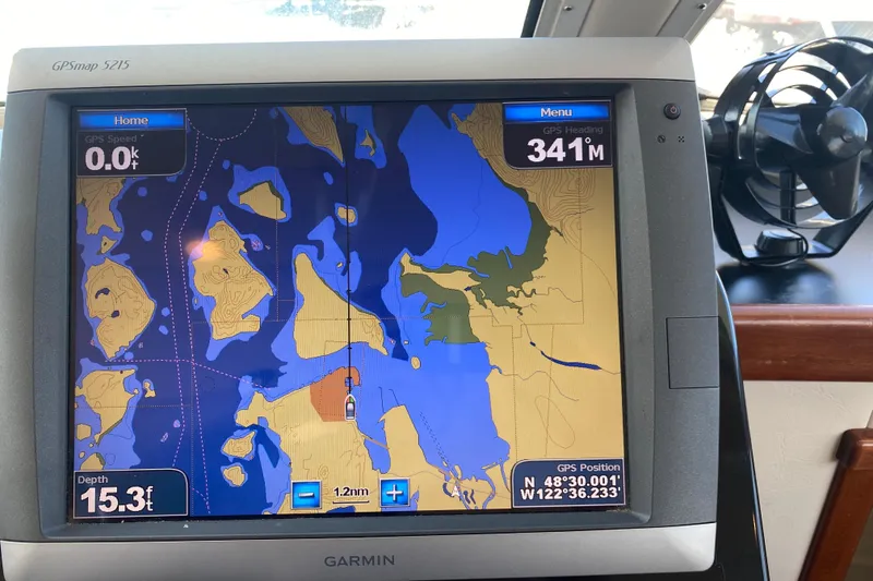 Slide: The Image of GPS navigation screen on a Zeta 36 boat, displaying nautical map and coordinates. - 39