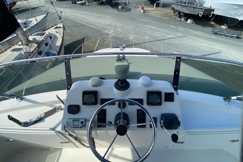 Slide: The Image of Helm of 2003 Zeta 36 boat with navigation instruments and steering wheel. - 53
