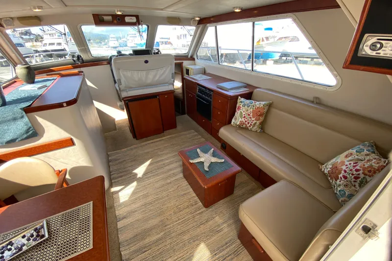 Slide: The Image of Luxurious interior of 2003 Zeta 36 yacht with plush seating and elegant decor. - 6