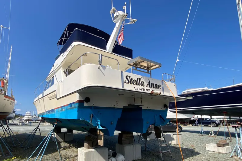 Slide: The Image of A 2003 Zeta 36 boat named "Stella Anne" on dry dock under clear blue skies. - 76