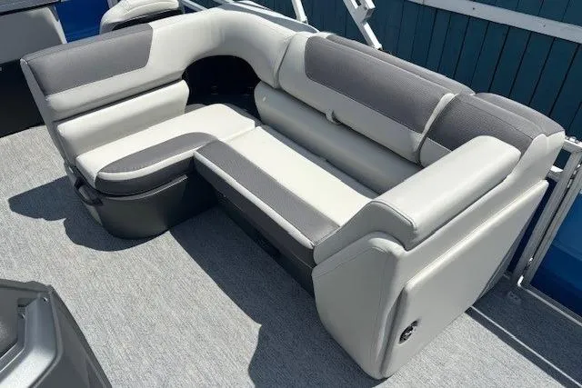 Slide: The Image of 2026 Sun Tracker Fishin' Barge 20 DLX, gray and white seating, outdoor boat interior. - 13