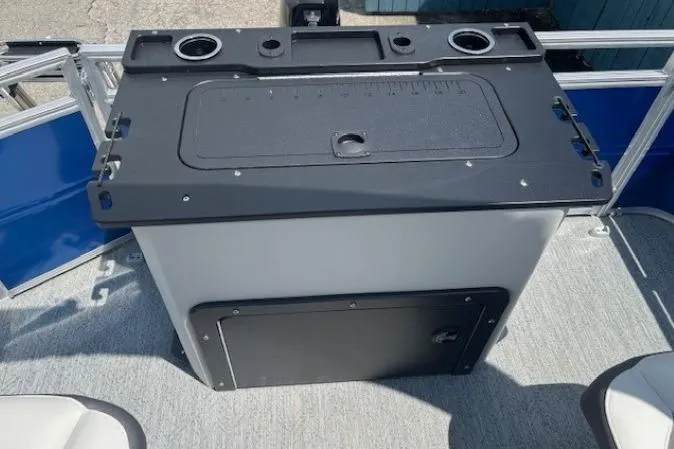 Slide: The Image of 2026 Sun Tracker Fishin' Barge 20 DLX fishing station with cup holders and storage. - 19