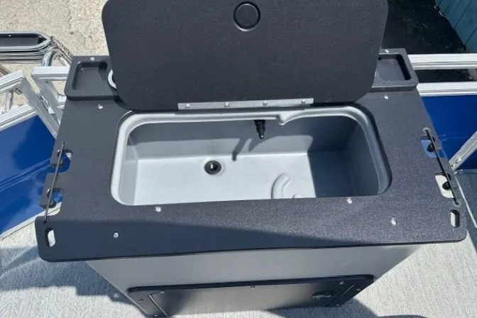 Slide: The Image of Open storage compartment on 2026 Sun Tracker Fishin' Barge 20 DLX boat. - 20