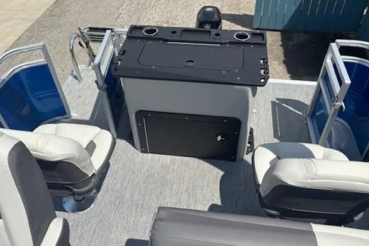 Slide: The Image of 2026 Sun Tracker Fishin' Barge 20 DLX interior with seating and control console. - 24