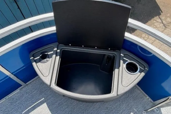 Slide: The Image of 2026 Sun Tracker Fishin' Barge 20 DLX storage compartment with cup holders. - 9