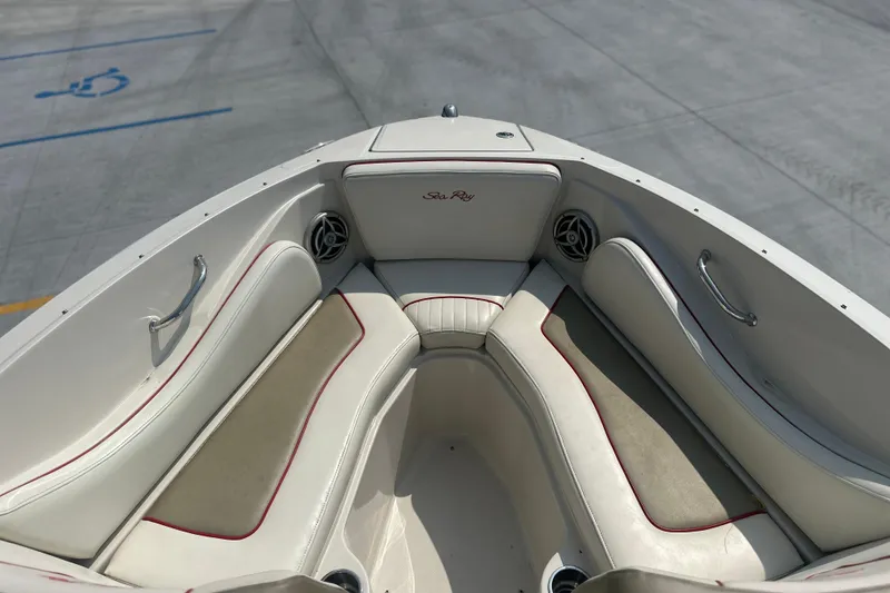 Slide: The Image of 2007 Sea Ray 230 Select boat interior with white seating and red accents. - 13